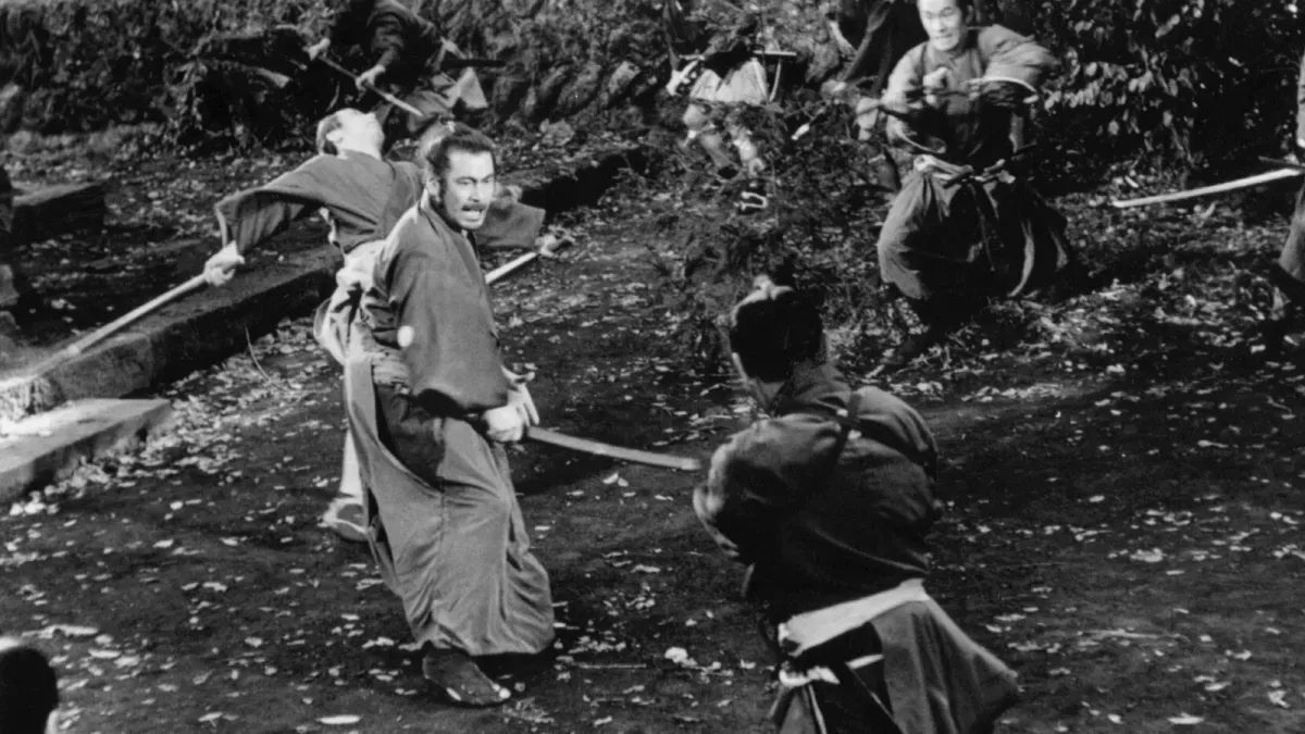 Sanjuro faces a crowd of attackers alone, sword drawn, from Akira Kurosawa's Sanjuro (1962)