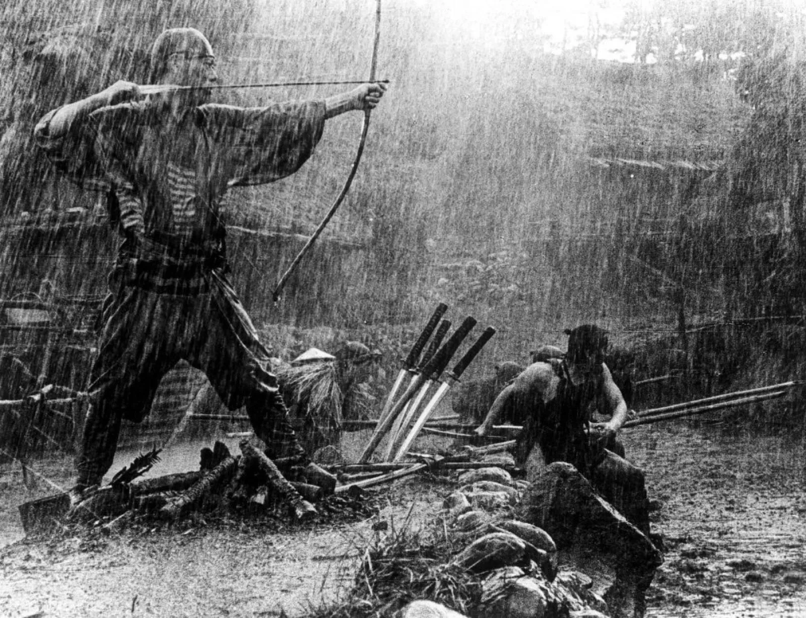 A samurai drawing a bow in the driving rain in Akira Kurosawa's Seven Samurai (1954)